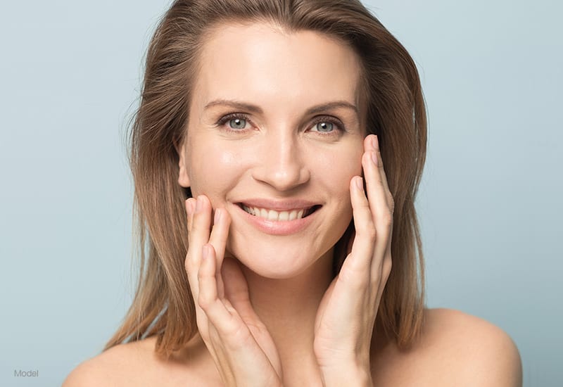 woman with hands on face